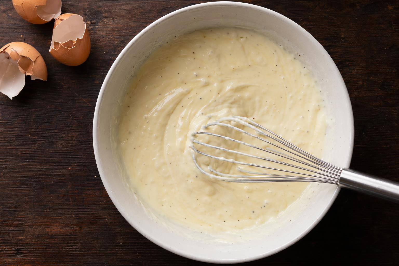 Greek yogurt and eggs whisked into a smooth ribbon-like mixture