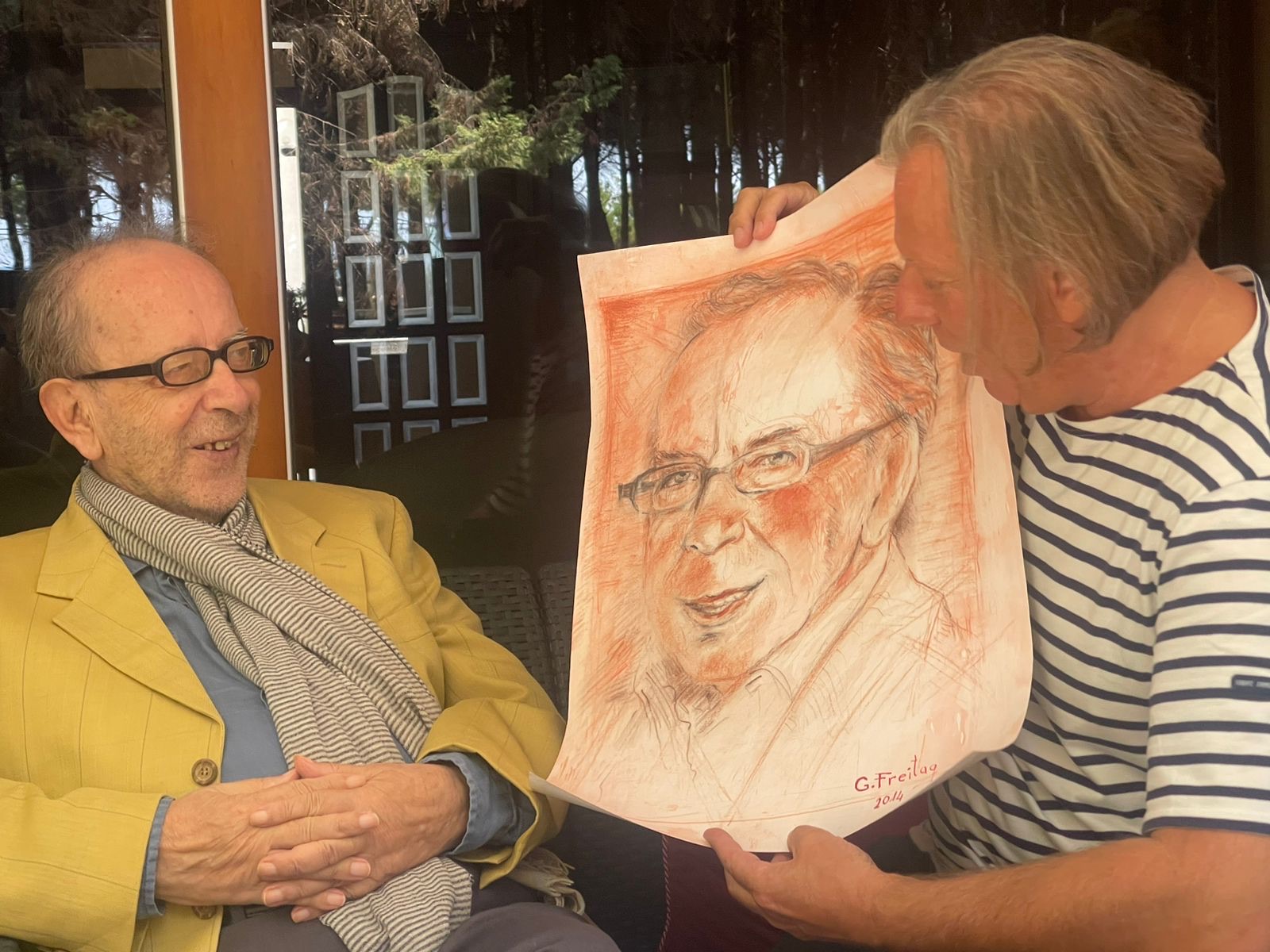 Kadare at his summer home in Qerret, September 2023, with painter Gazmend Freitag — months before his death.