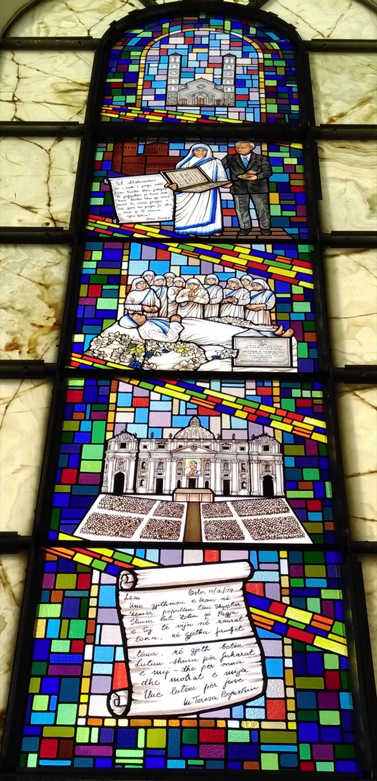 Stained-glass window in the Cathedral of Saint Mother Teresa in Pristina, Kosovo, depicting key moments from her life.