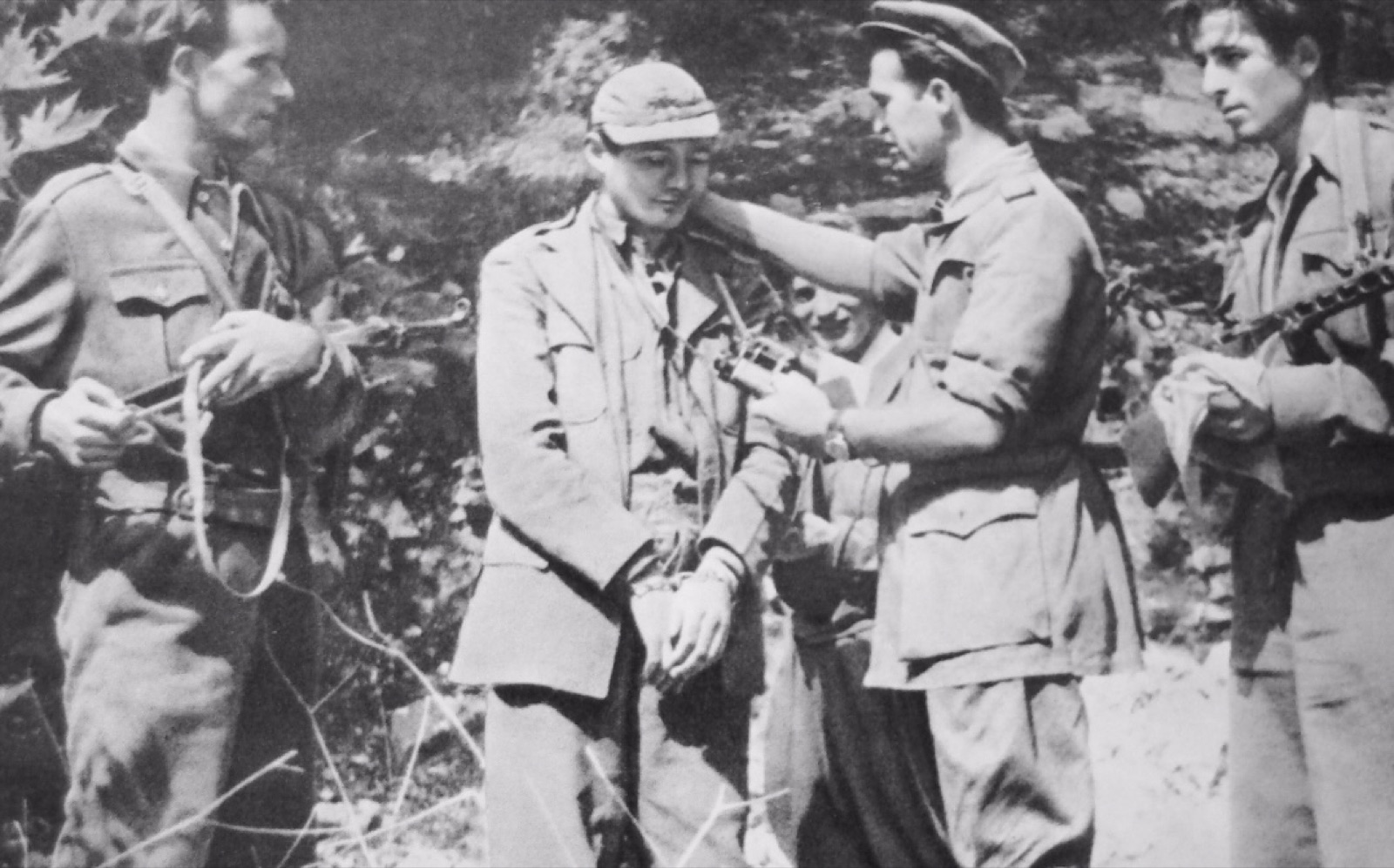 Sigurimi officers with a captured Western-backed agent — a publicity image from Albanian state security.